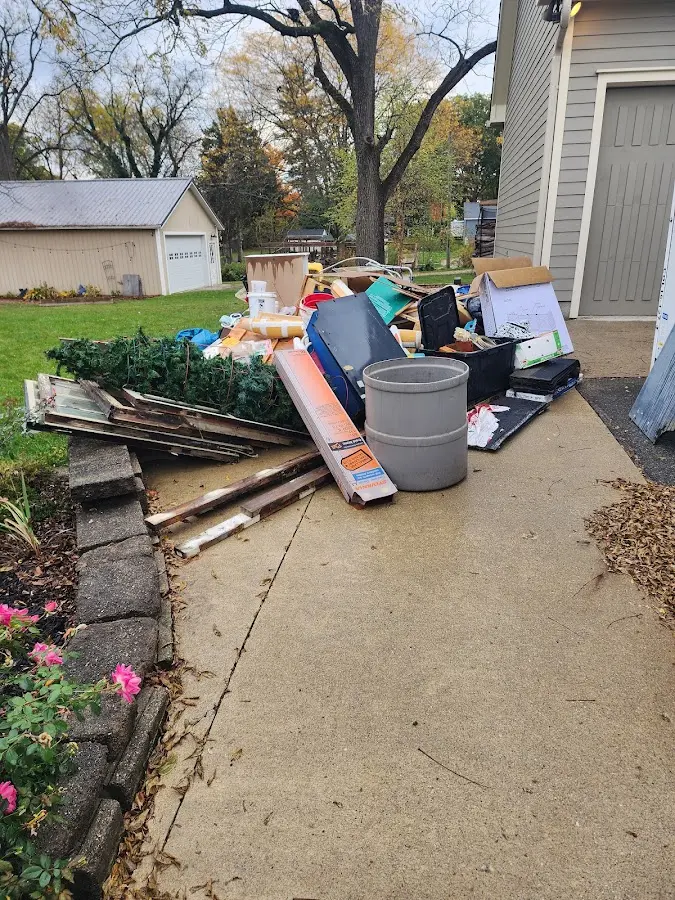 Dumpster being loaded with debris for Roofing Dumpster Rental in Mount Laurel